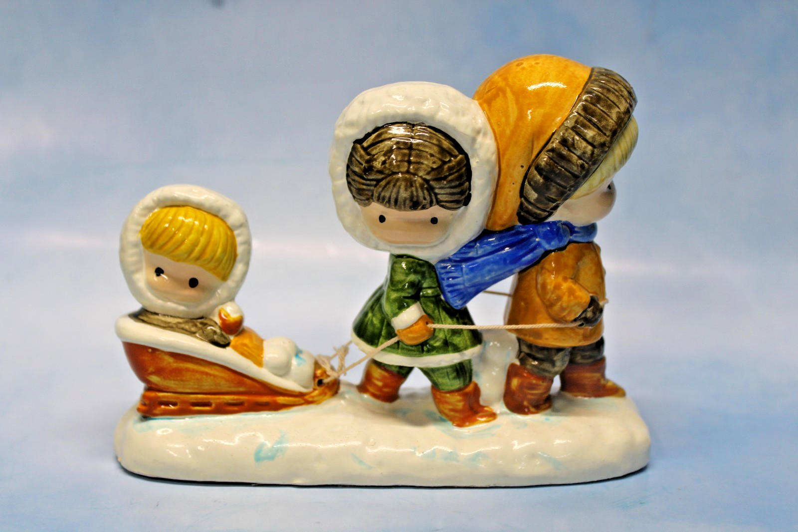 Joan Walsh Anglund. Vtg 1972 Ceramic Figurine children sledding made in Japan.