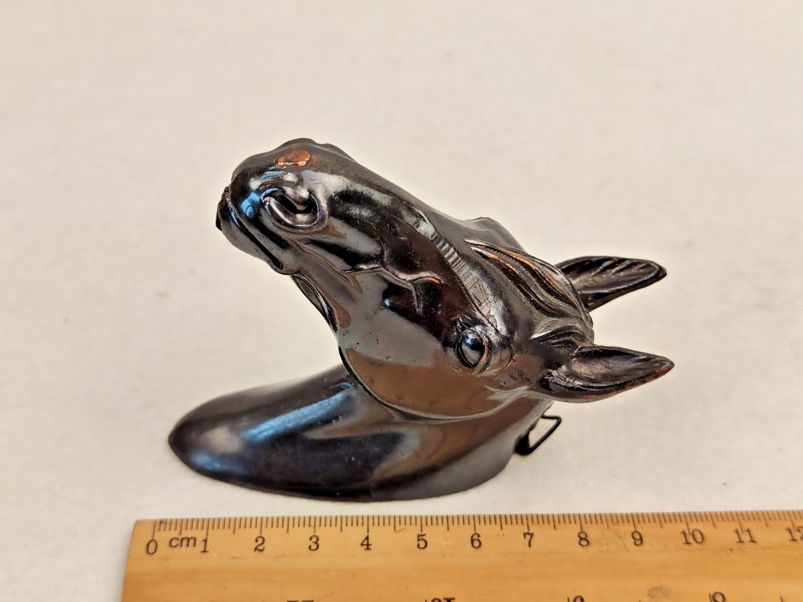 A decorative wall sculpture in the shape of a horse’s head