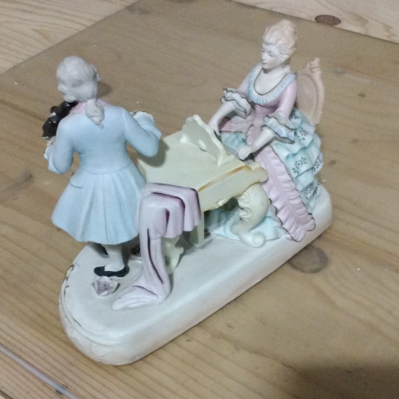 Hand painted bisque figurine couple playing music