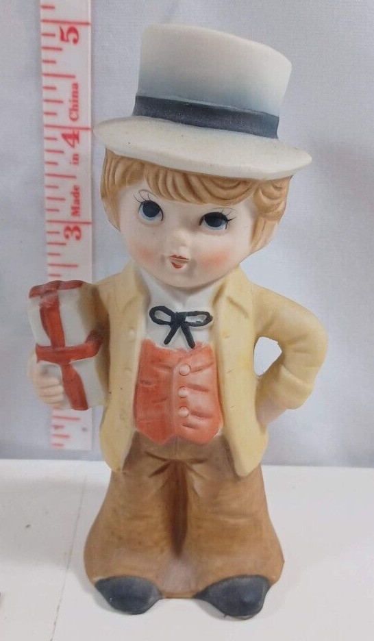 5 inch ceremic boy with gift no markings