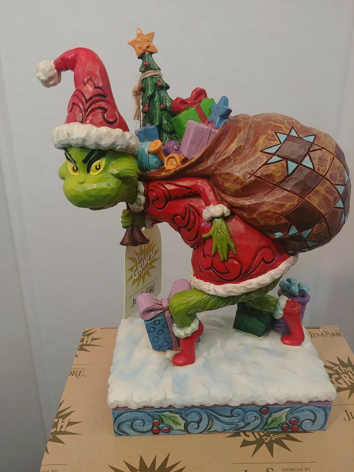 Dr. Seuss Grinch by Jim Shore Grinch Tip Toeing with Bag of Gifts 7.7″ Figurine