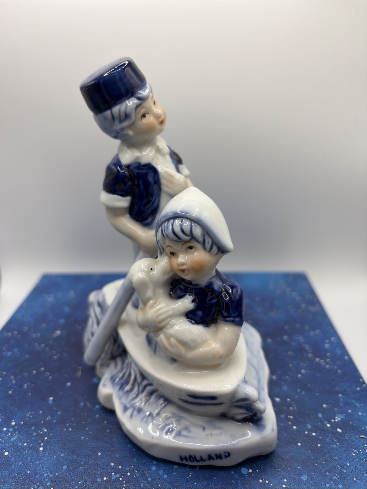 “Dutch Boy Rowing, Girl & Pup: Vintage Holland Souvenir Figurine”