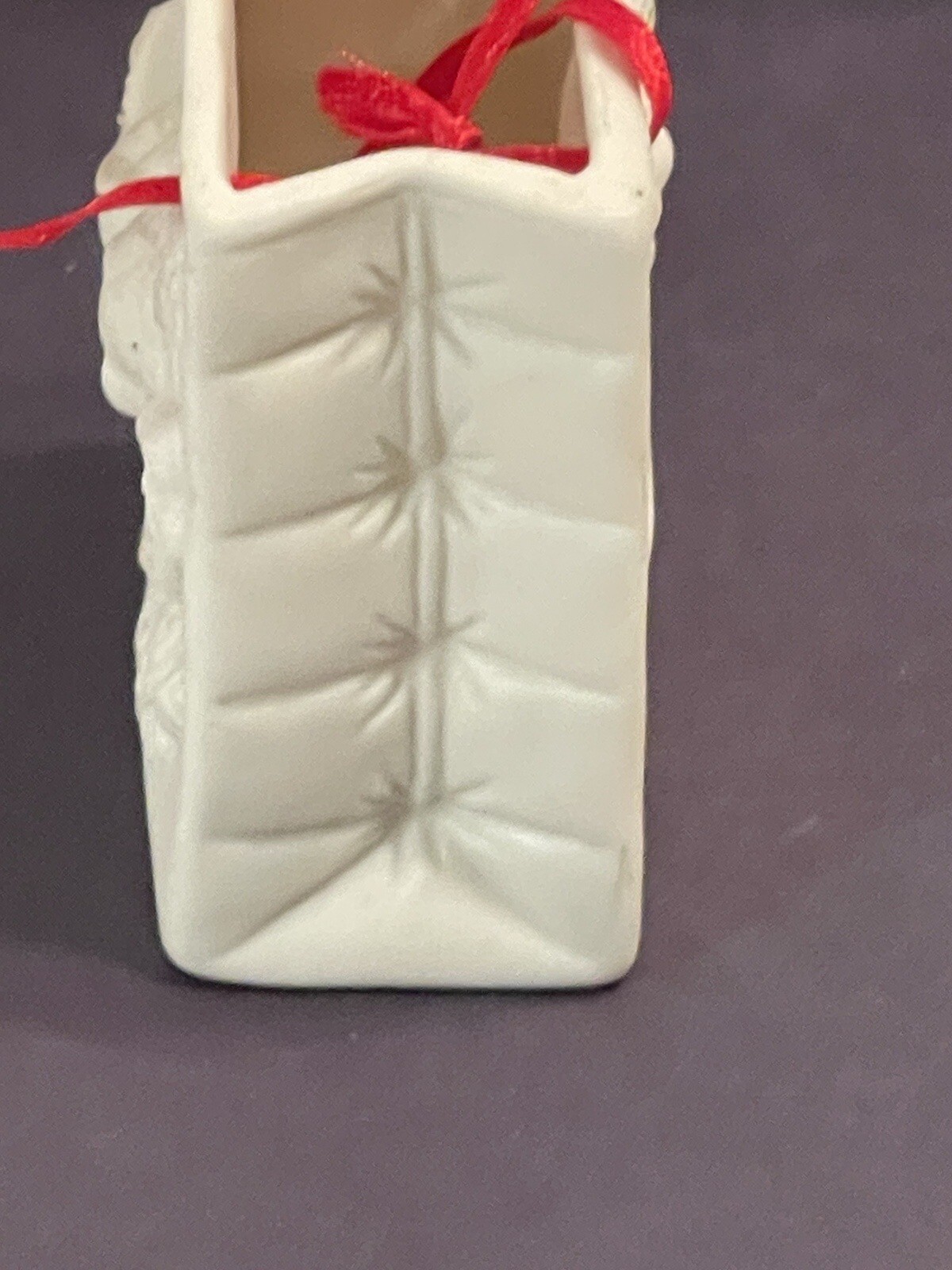 Autom China White Porcelain Cherub Bag With Red Ribbon Handle