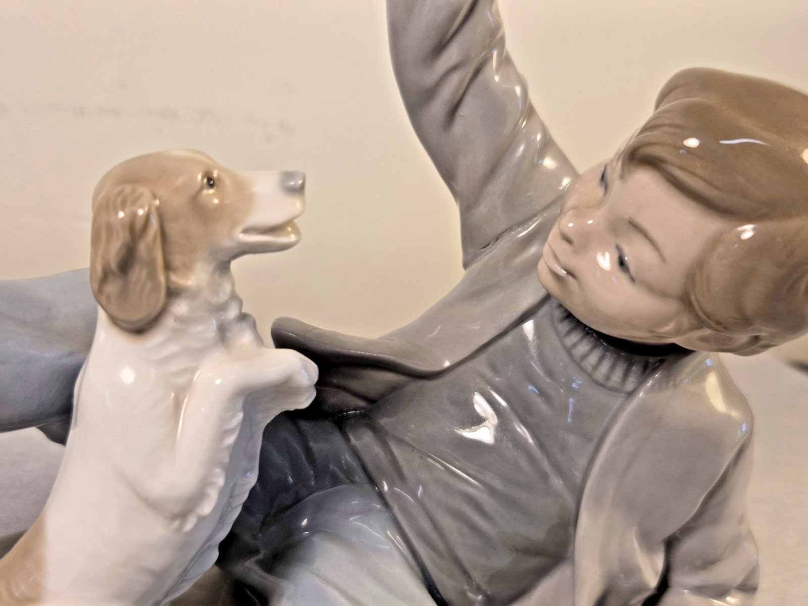 NAO by Lladro Figurine “Boy Playing with Dog” Model #0278 8″ Long x 6.5″ Tall