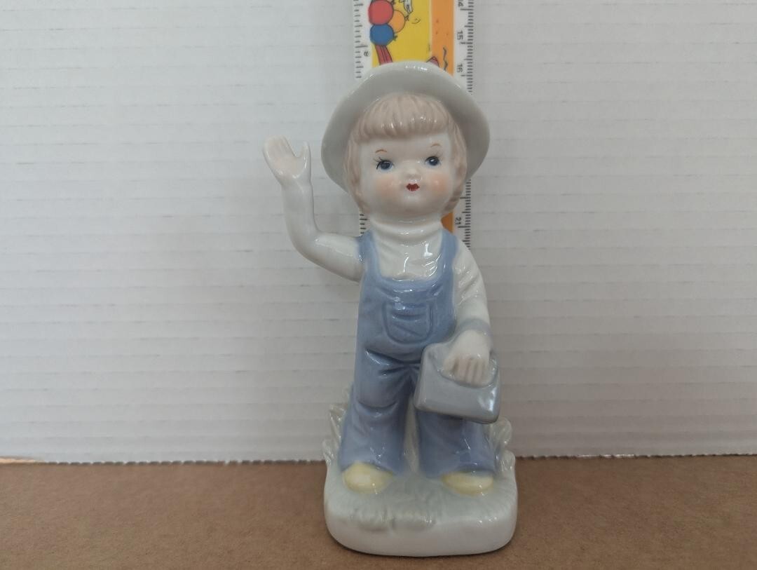 Vintage Girl Figurine Porcelain Girl with Purse wearing Overalls