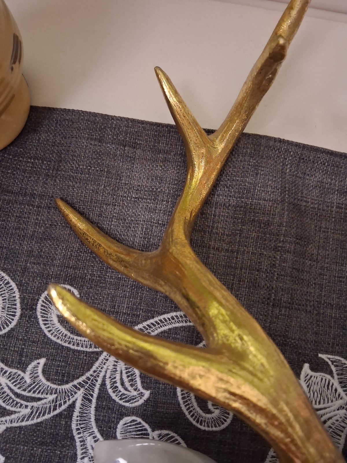 White Marbled Deer Head Hangs On Wall With Gold Antlers About 18″ Tall