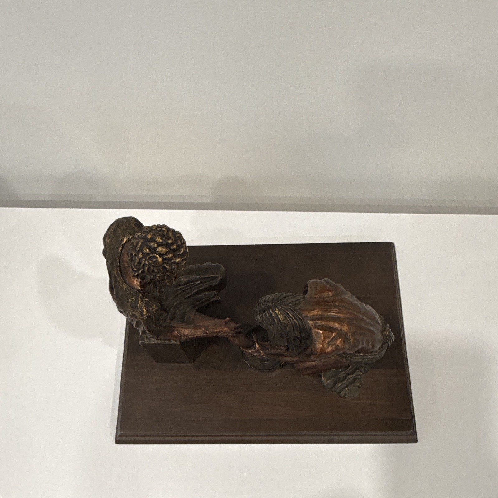 Signed Bronze statue of Jesus washing the feet of Peter at the last Supper