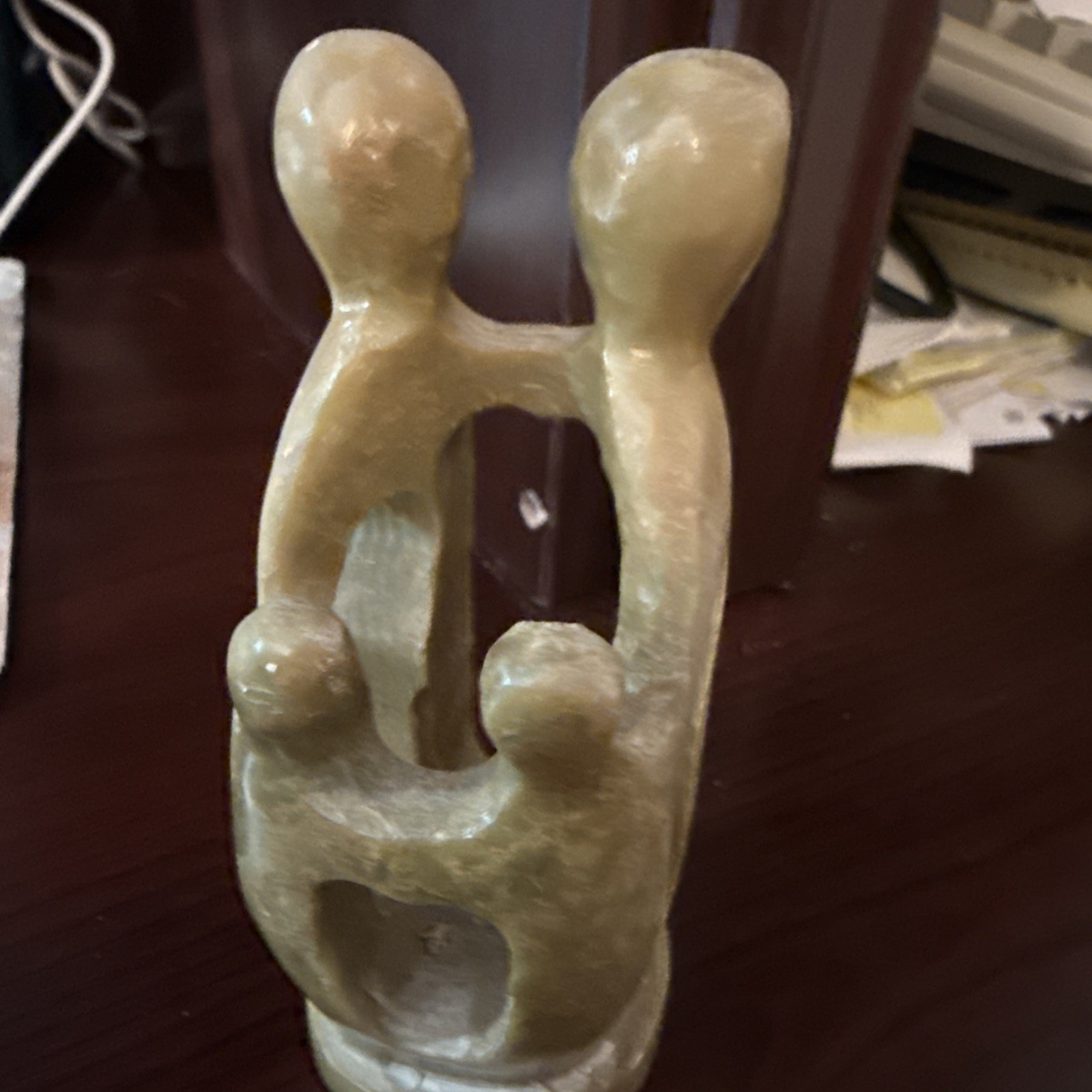 Handcrafted Soapstone Signed Figurine – Man, Woman, and Child Embracing 7.5″