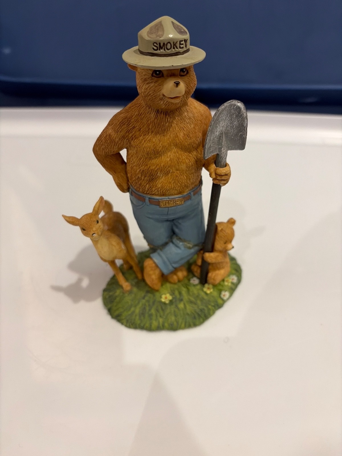 Vintage Smokey the Bear Figurine with Shovel and a Cub and a Deer