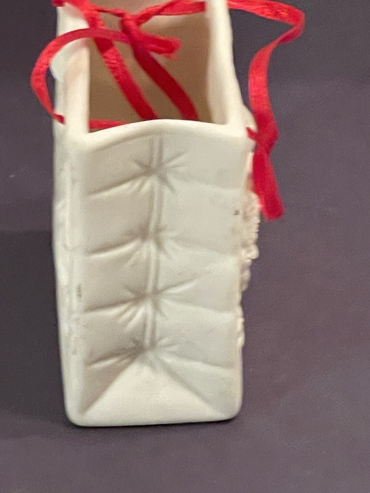 Autom China White Porcelain Cherub Bag With Red Ribbon Handle