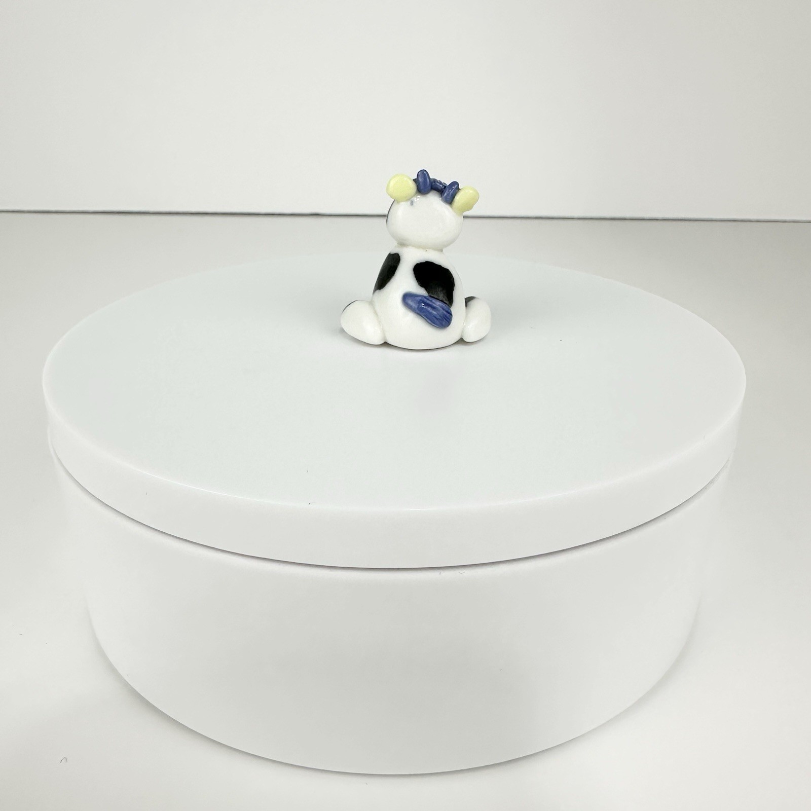 Vintage Mini Black And White Cow Figurine Sitting