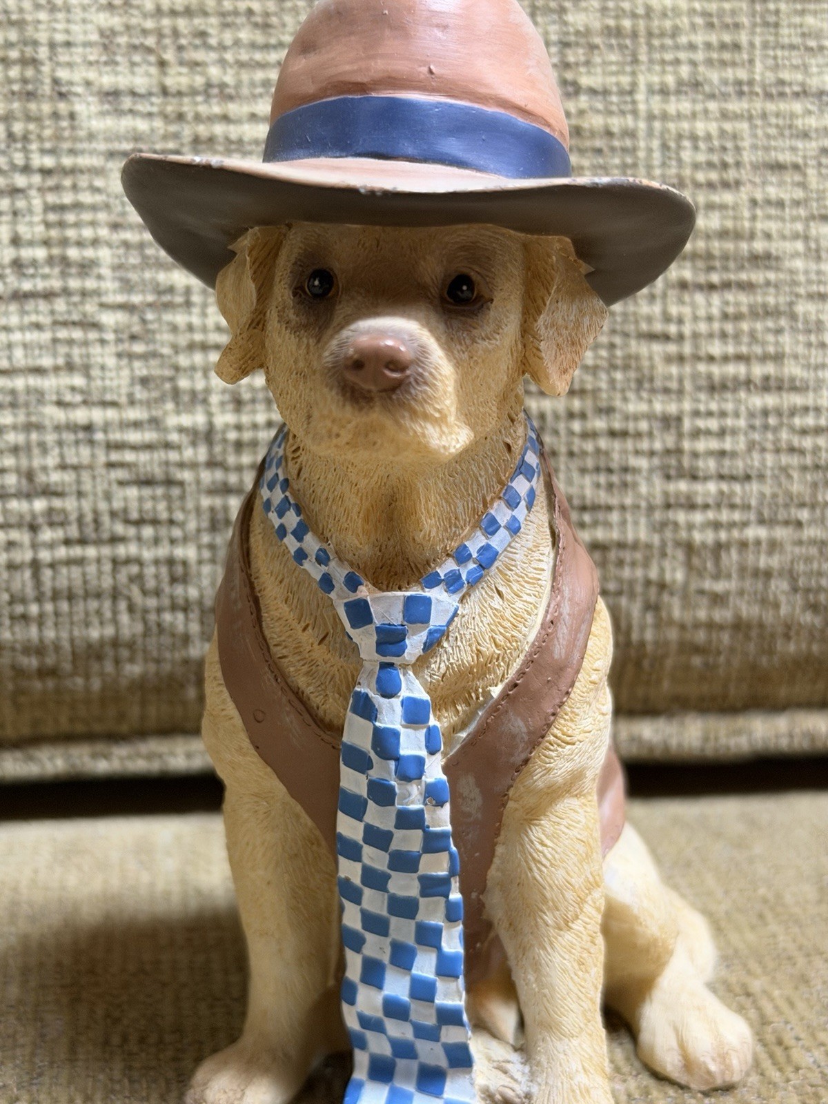 lifelike dog figurine in clothes