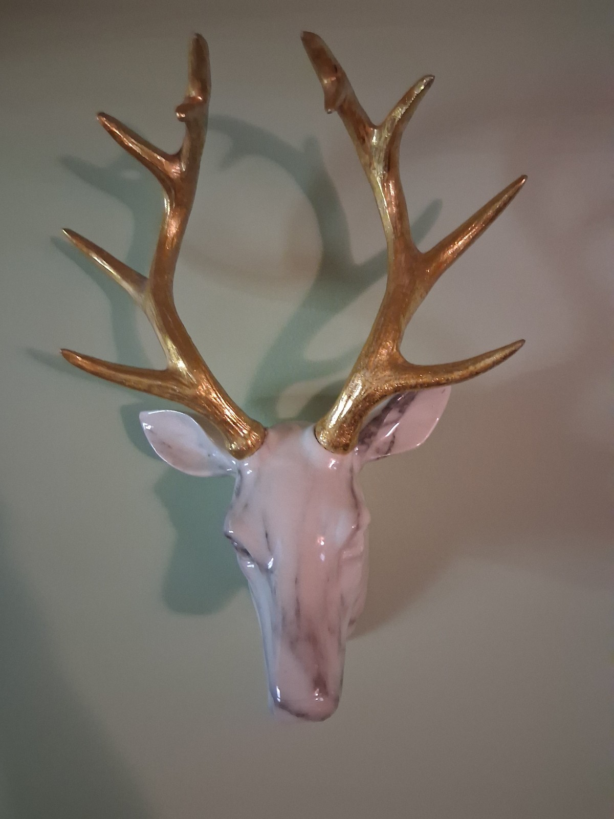 White Marbled Deer Head Hangs On Wall With Gold Antlers About 18″ Tall