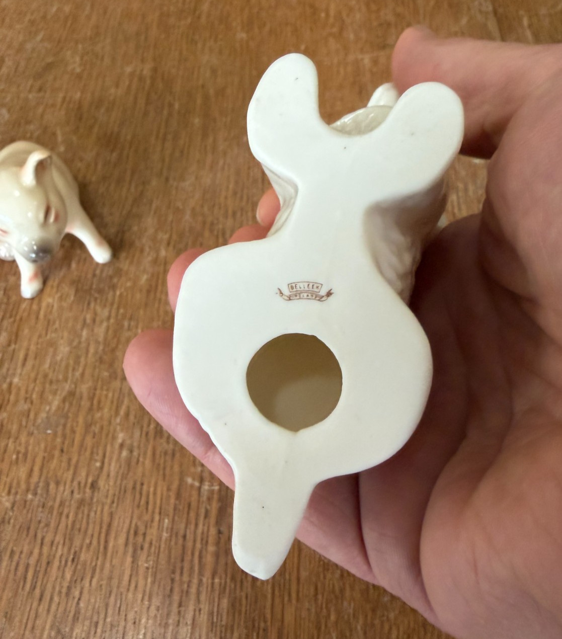 Pair of Belleek Terrier Dog Figurines with a Goebel Pig Figurine