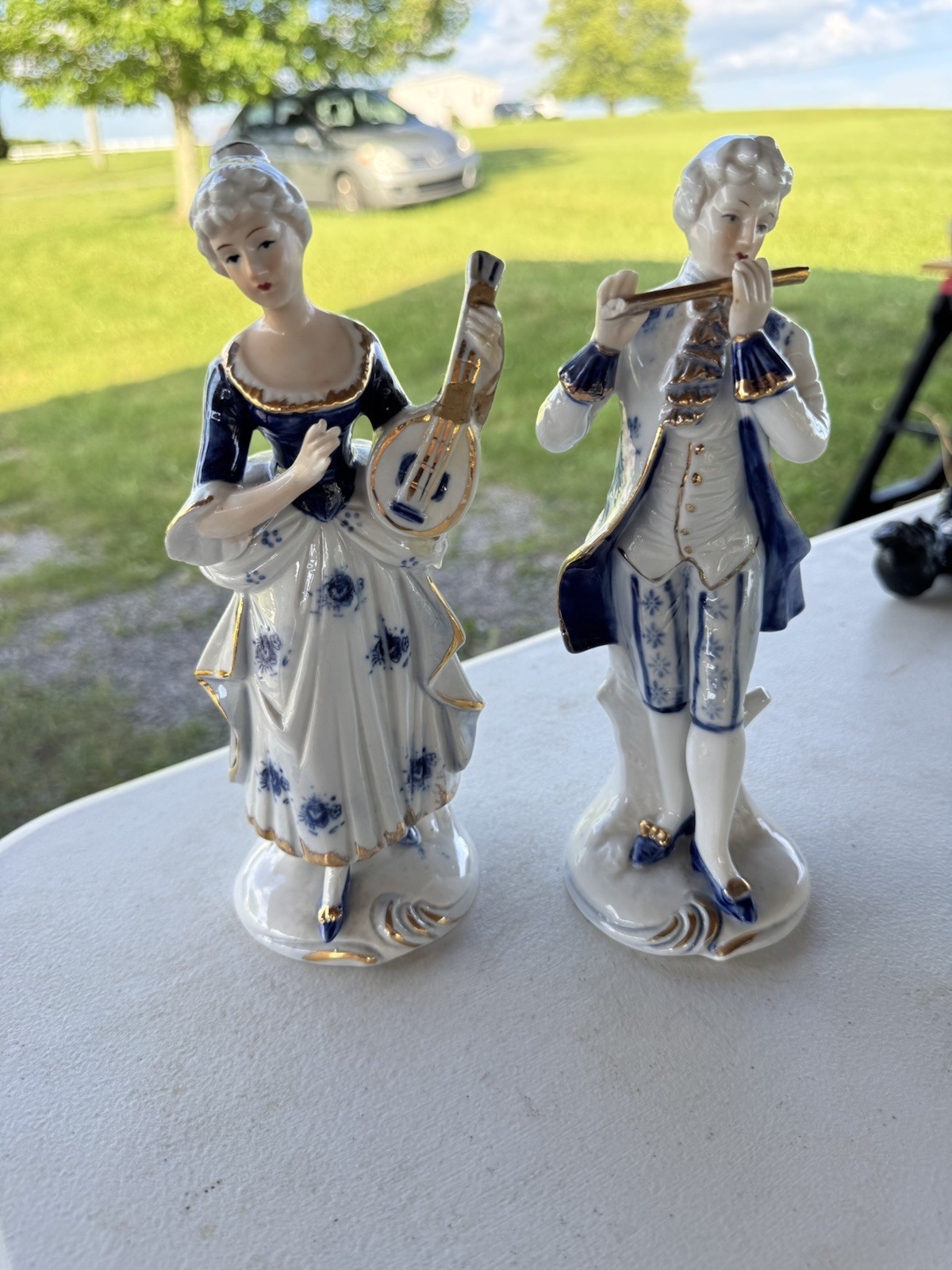 Hand Painted Blue & White Glazed Porcelain Musician Figurines Pair Floral