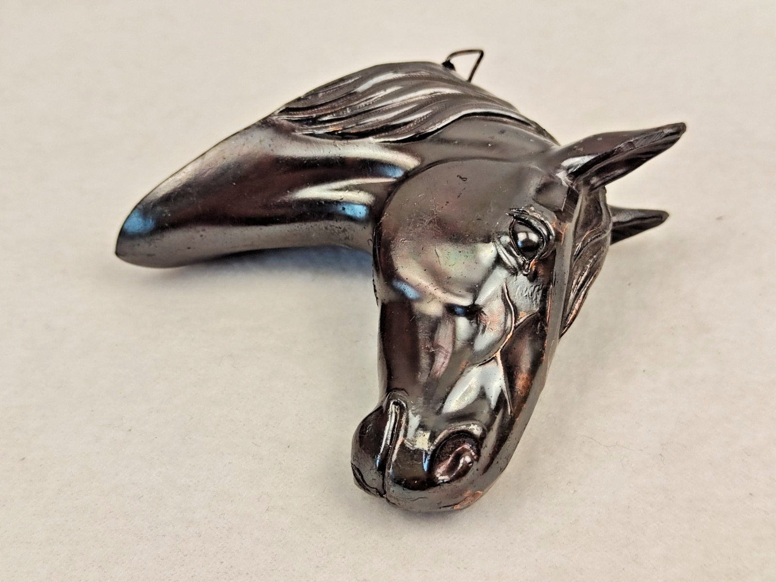 A decorative wall sculpture in the shape of a horse’s head