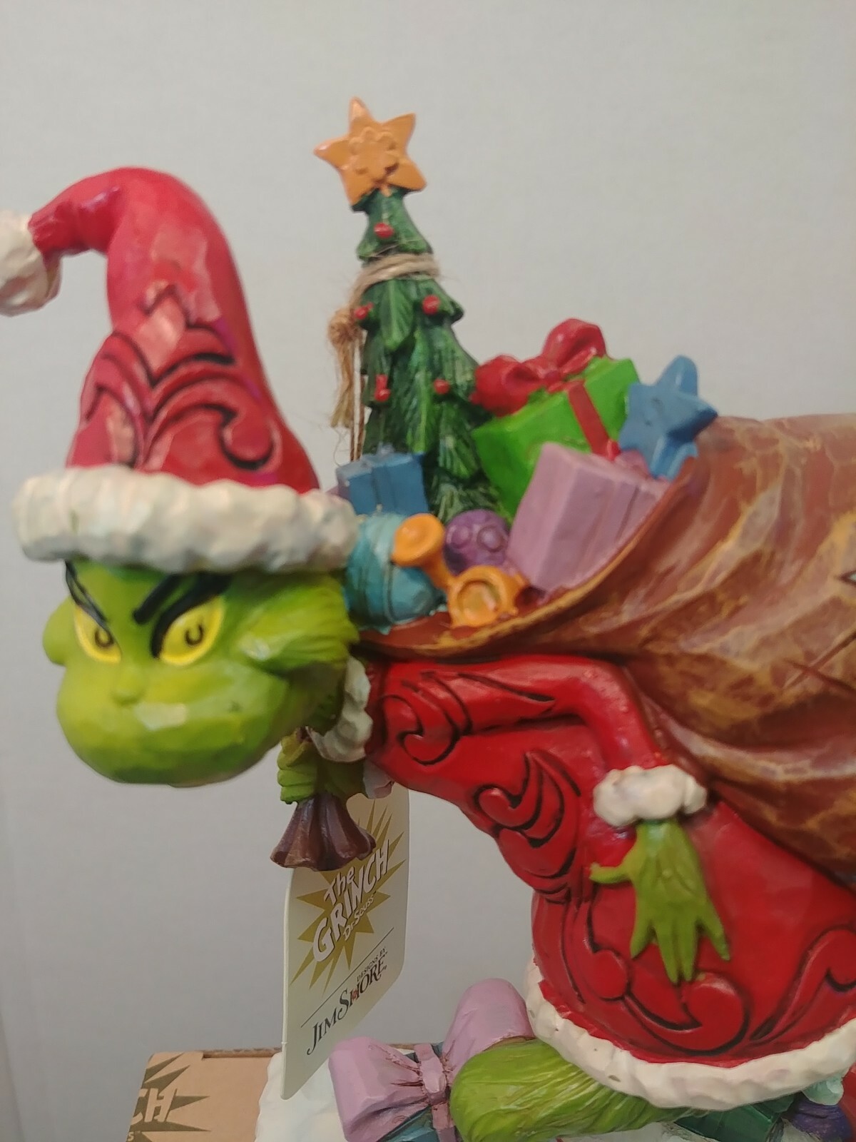 Dr. Seuss Grinch by Jim Shore Grinch Tip Toeing with Bag of Gifts 7.7″ Figurine