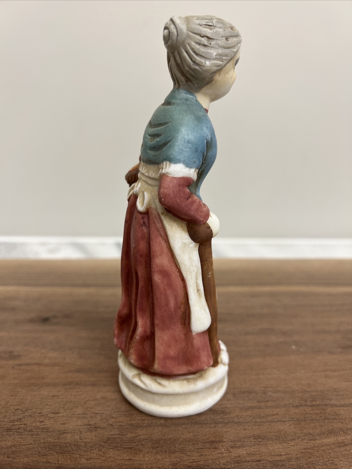 Vintage Old Woman Carrying Basket Of Apples 6 inches tall Porcelain.