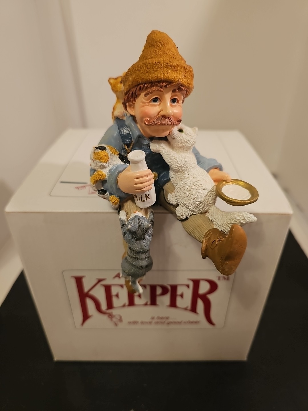Shenandoah Designs International A Keeper of Cats – Man feeding cats New