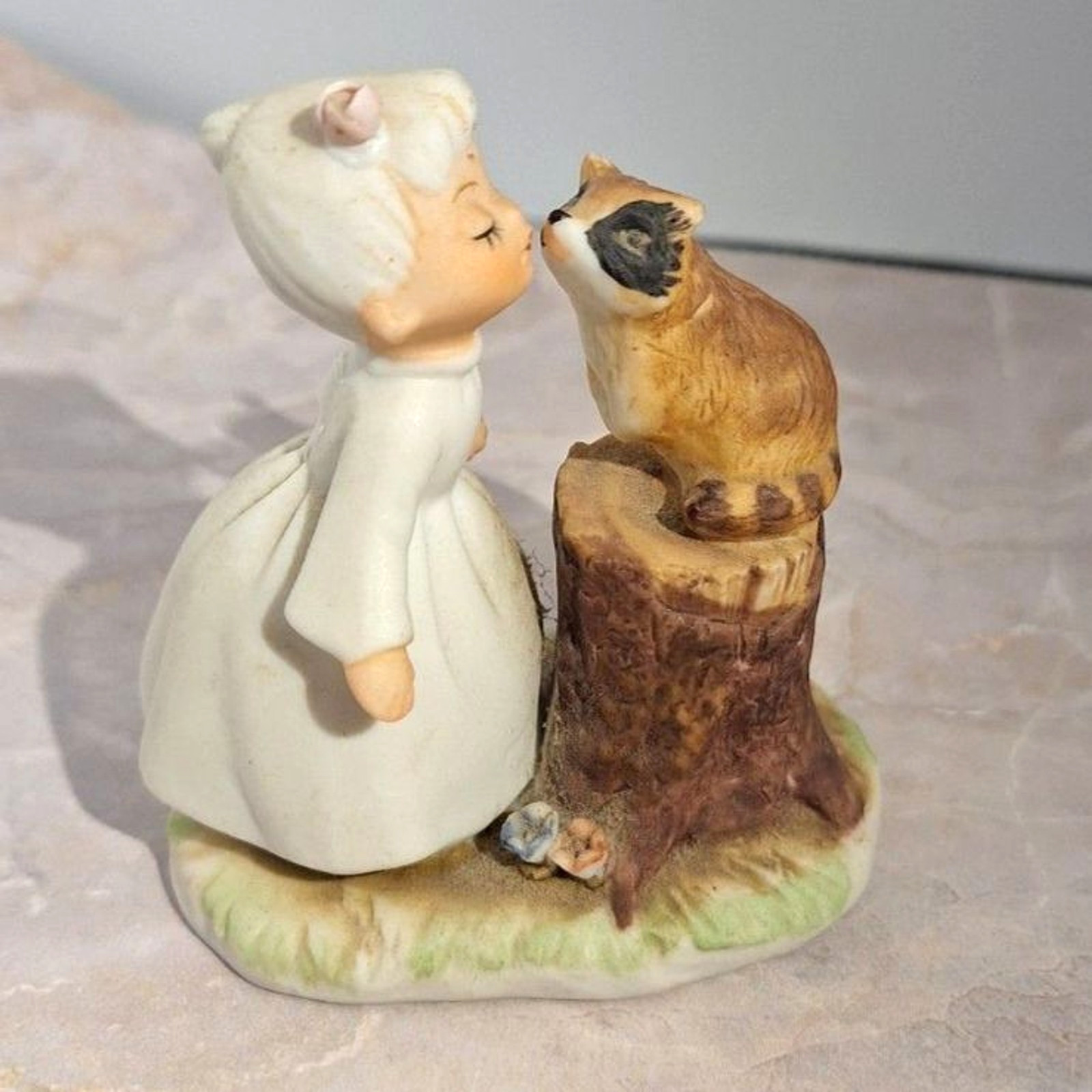 A Bisque Porcelain Vintage Girl And Raccoon Figurine Matte Finish Collectible