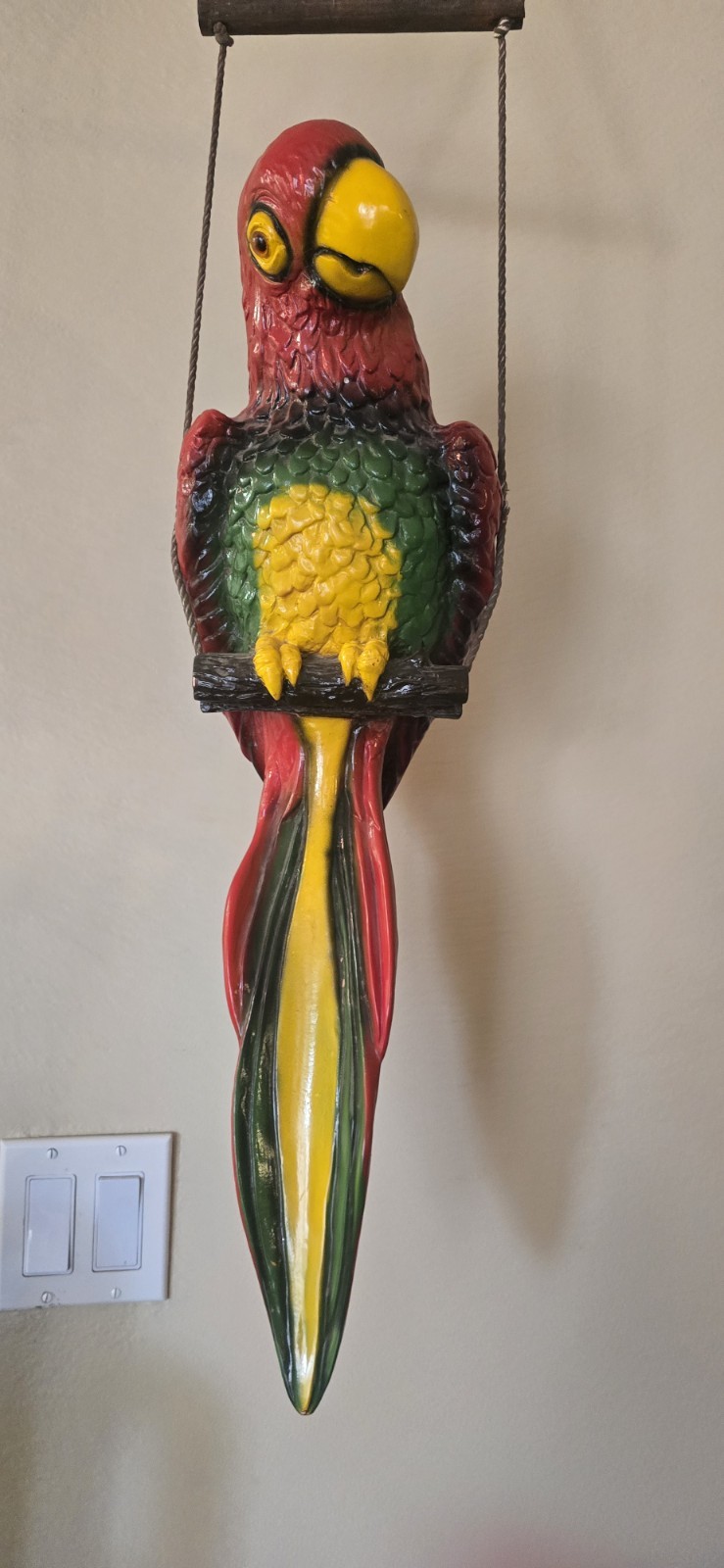 Decorative hanging parrot sculpture 42inches total Parrot is 24inches.