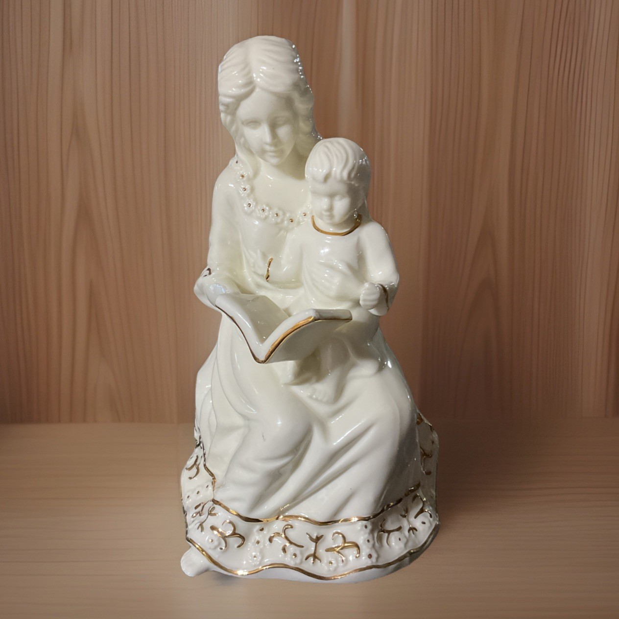Formalities By Baum Bros figurine woman holding a baby and reading a book 6.5”
