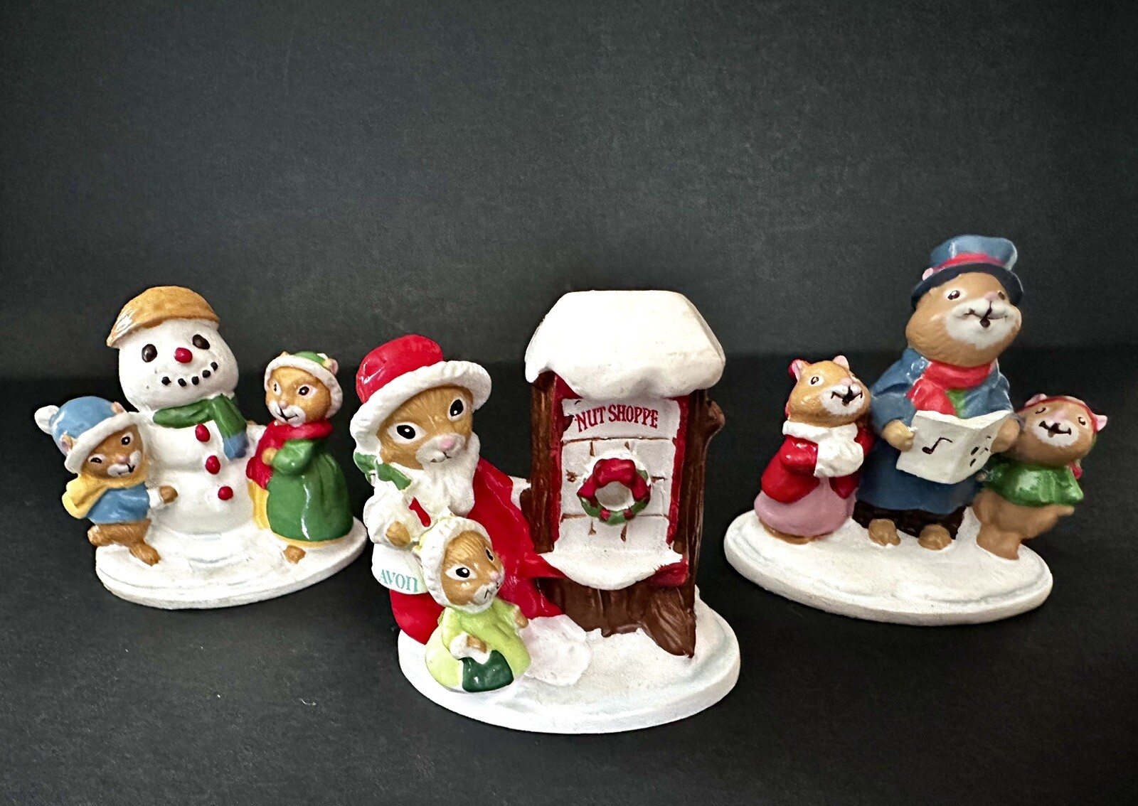 CHRISTMAS AVON FOREST FRIENDS FIGURINES LOT OF 3 – CAROLING-SNOWFALL-SHOPPING