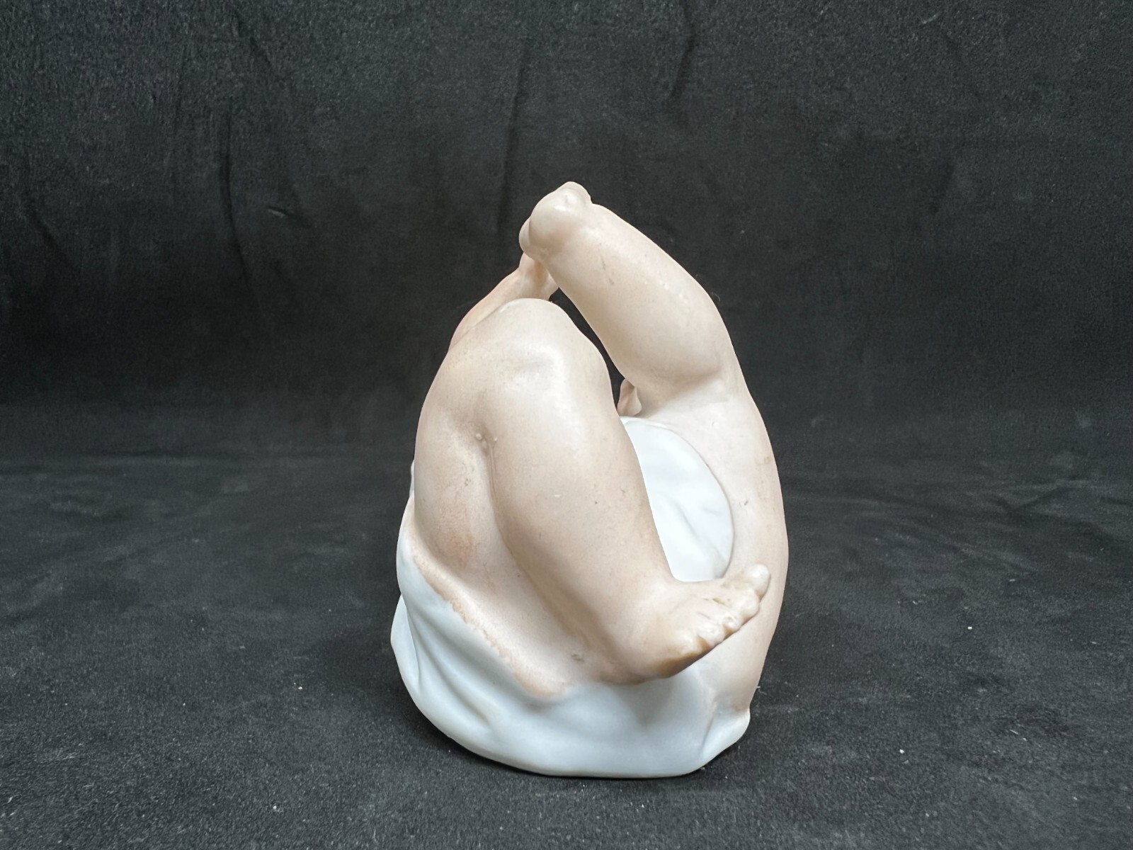 Gebruder Heubach-German Porcelain Bisque-Lying On Back Piano Baby–4 1/2″ Length