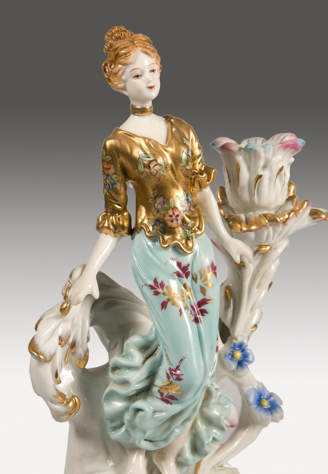 Pair of porcelain candle holders or candlesticks, after models from Sèvres.