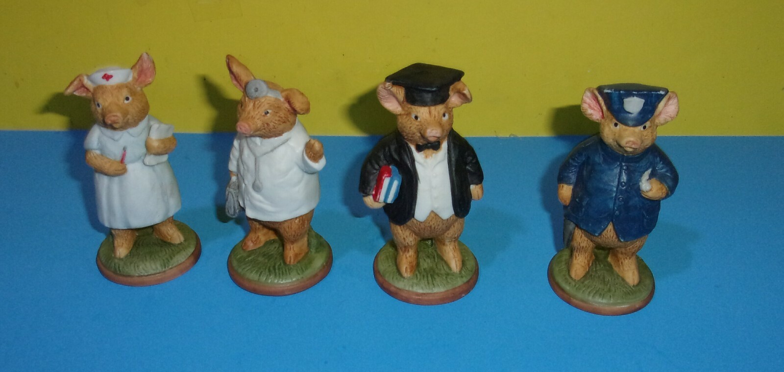 3 3/4″ Pigs about Town Porcelain Figures – Doctor, Nurse, Police Officer & Grad