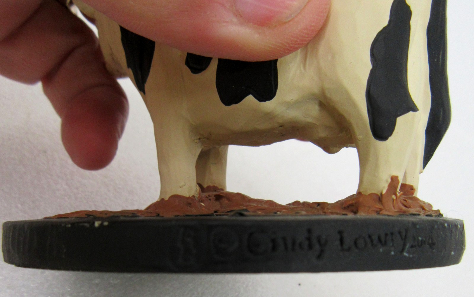 vtg Blossom Bucket artist signed Cindy Lowry cow figurine 3″ black white