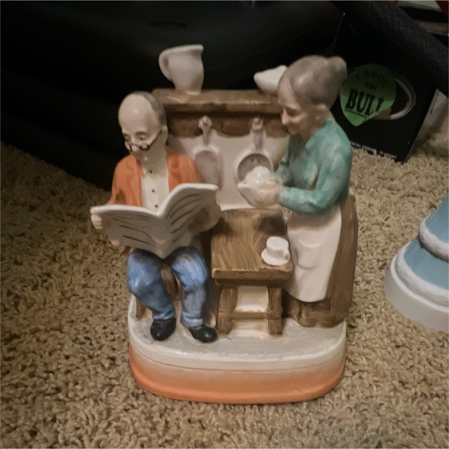 Multicolor Painted Ceramic People Figurine Reading Newspaper at Counter