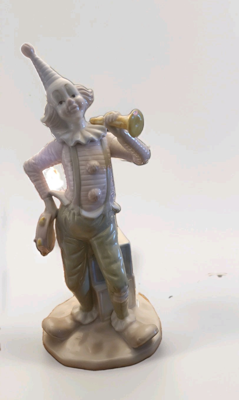 Vintage Paul Sebastian porcelain clown playing the horn and tambourine 12″