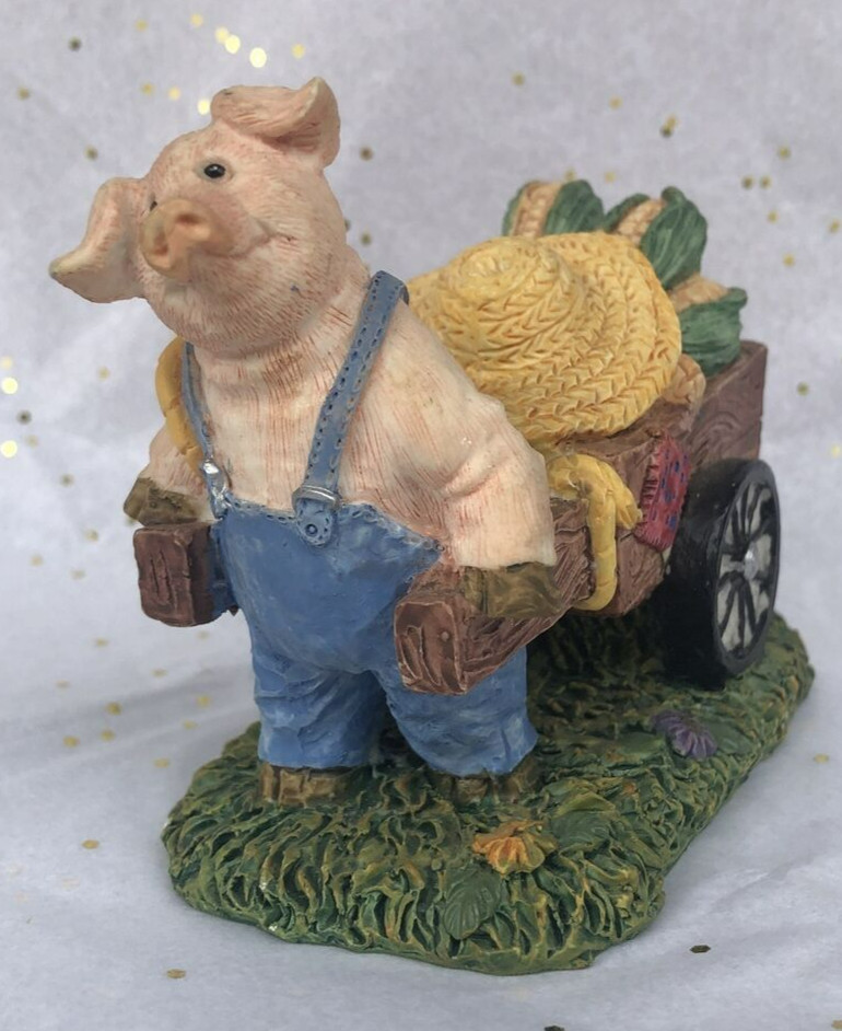 Pig Farmer Pulling a cart of Corn Cobs figurine. Unbranded, no markings