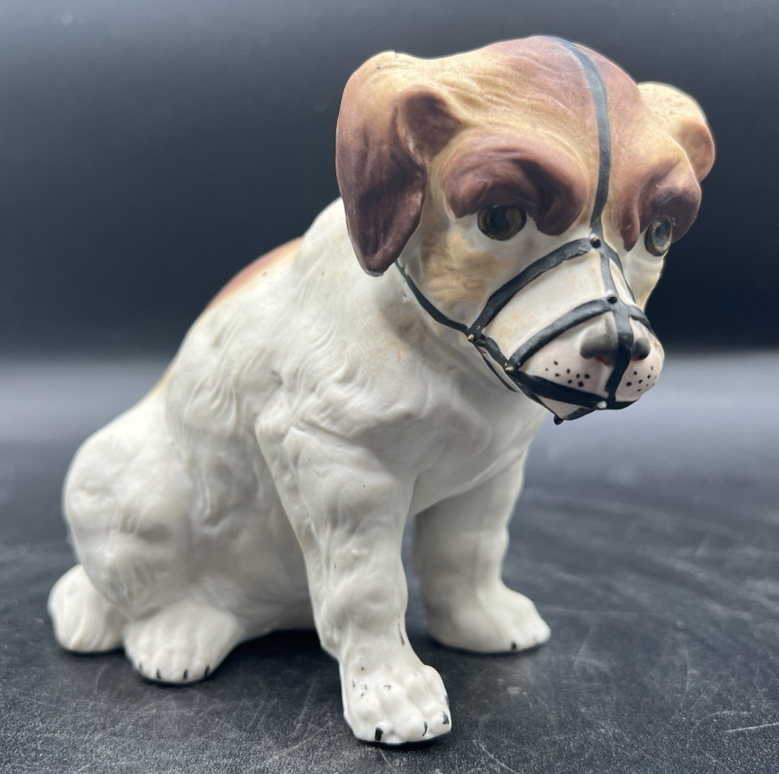 Gebruder Heubach-German Porcelain Bisque-Sittng Dog With Muzzle 4 1/2″
