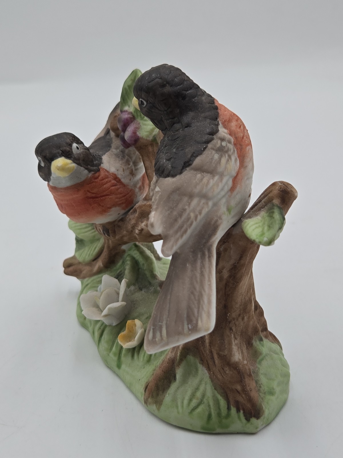 Vintage Lefton Robins on branch with flowers.