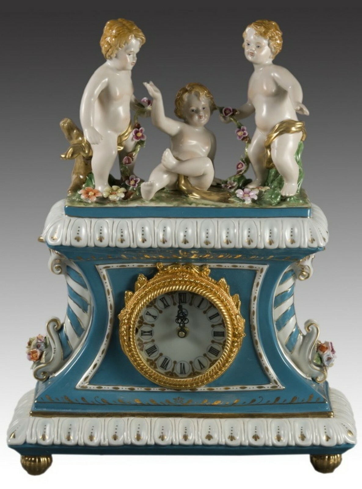 Porcelain mantle clock. After models from Sèvres.