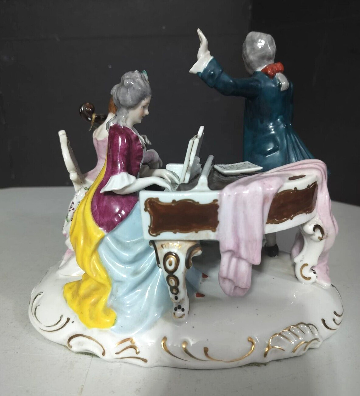 Antique Continental Porcelain Figurine Group, 7″ x 8.5″.