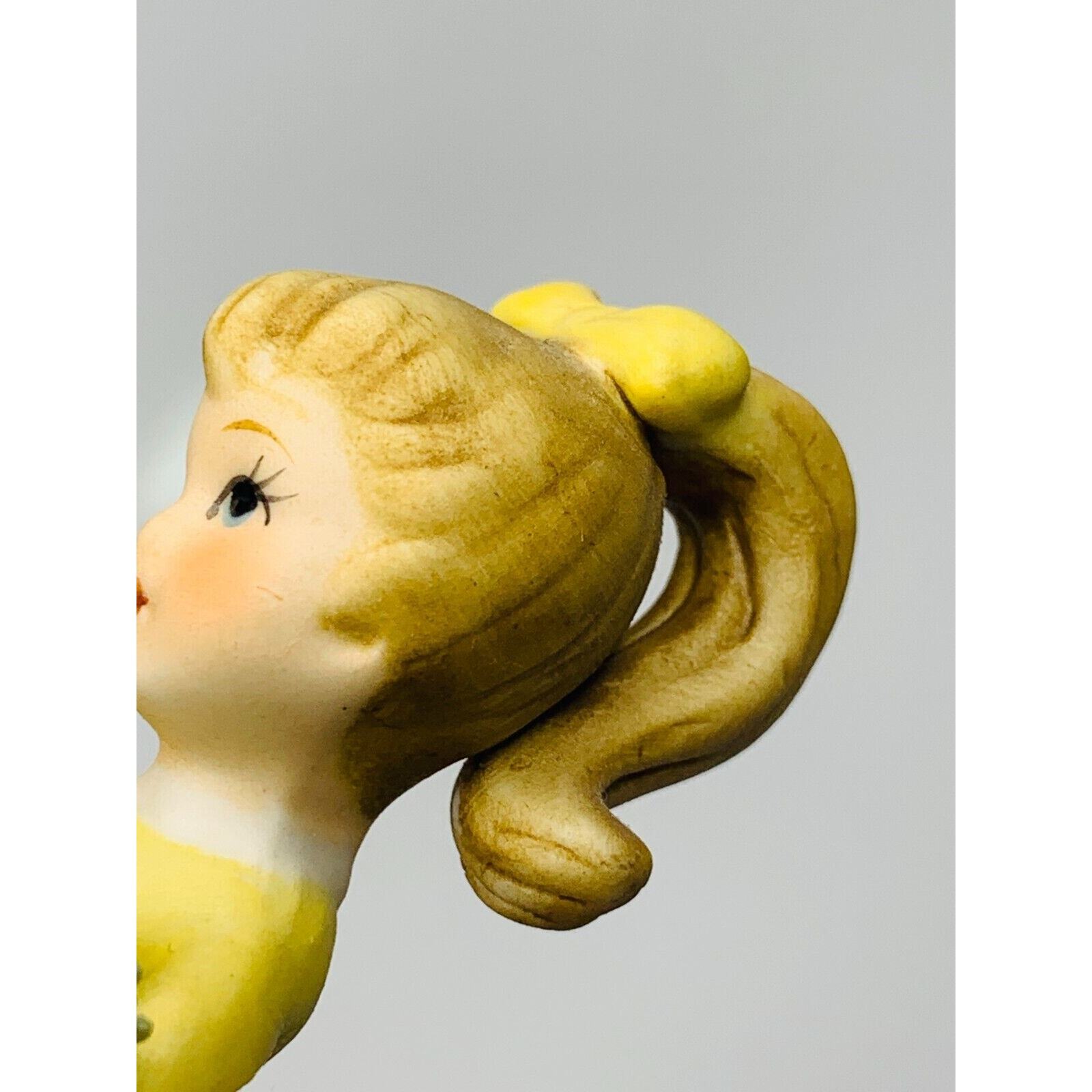 Napco Girl Figurine Yellow Dress and Bow With Blue Flower #8614