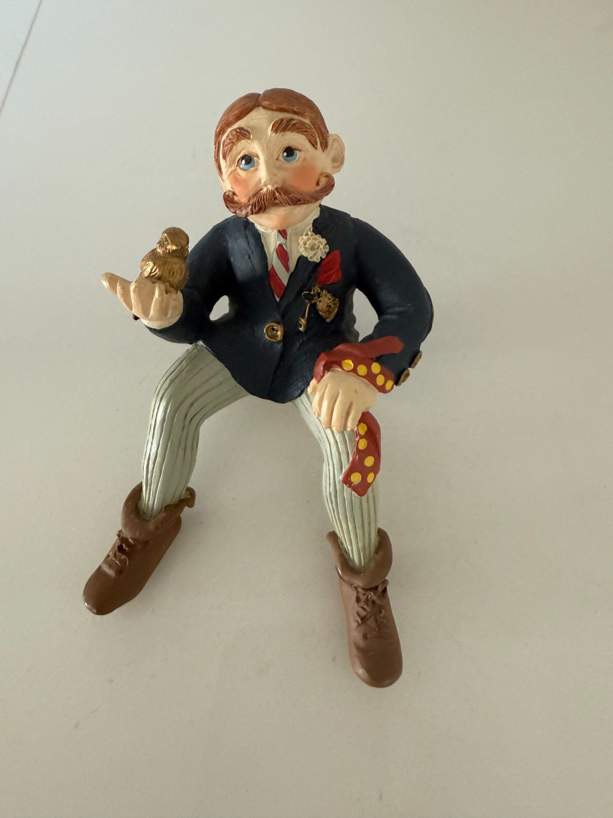 Shenandoah Designs Internatiional A Keeper Figurine Sitting Man w Bird in Hand