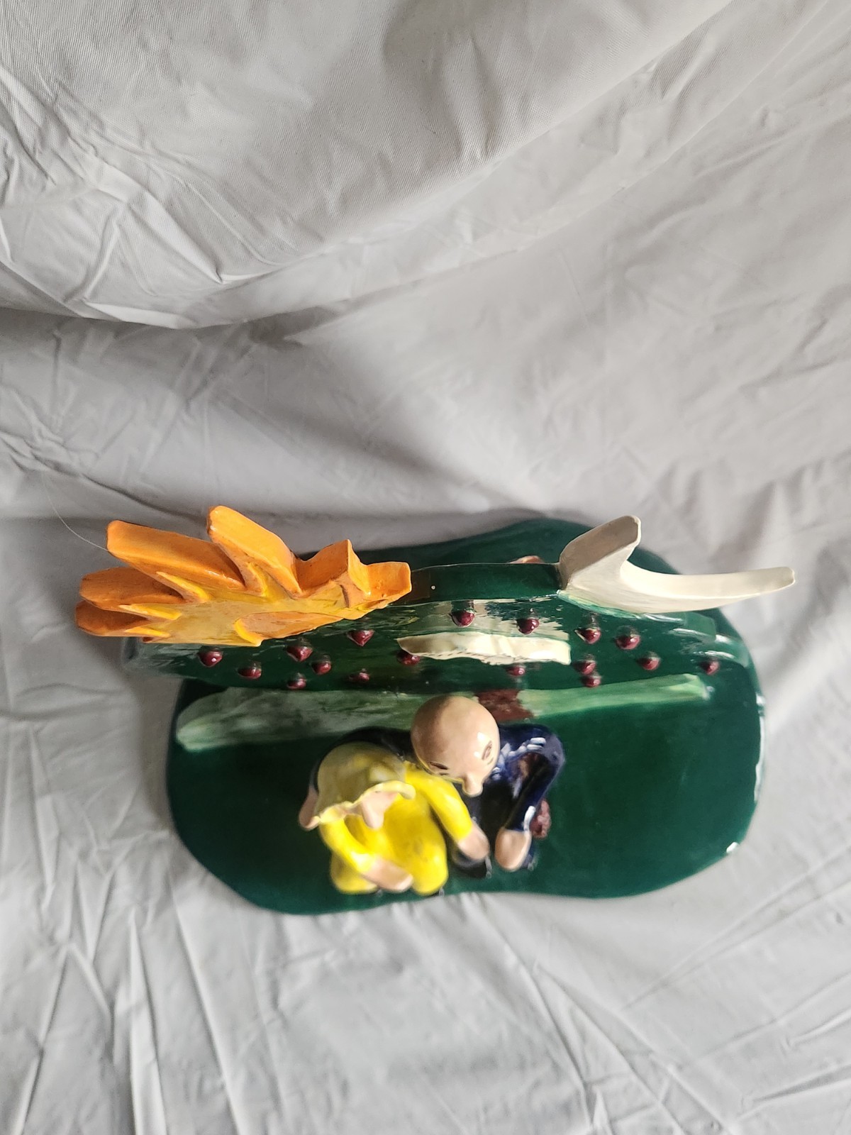 Handcrafted Ceramic Folk Art Style Figure of Couple Sitting on Bench Under Tree
