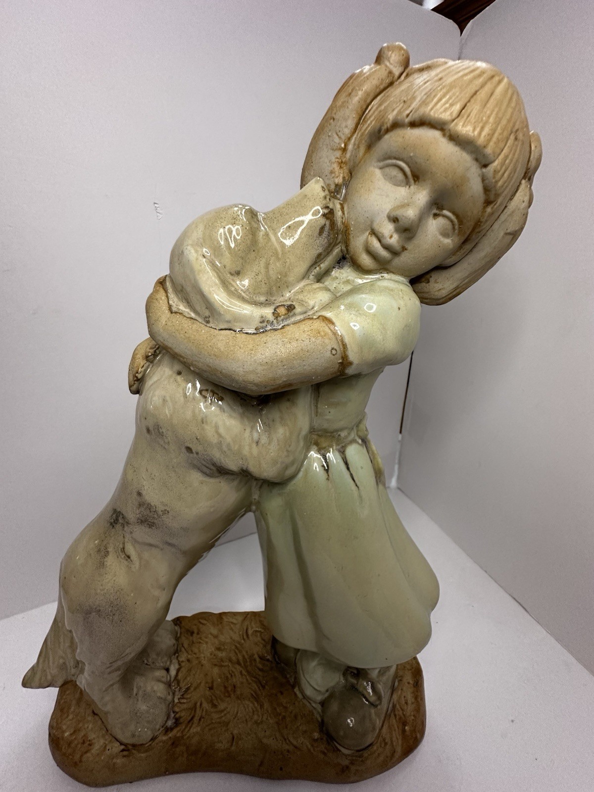 Girl Hugging her dog Ceramic ~16” Tall.