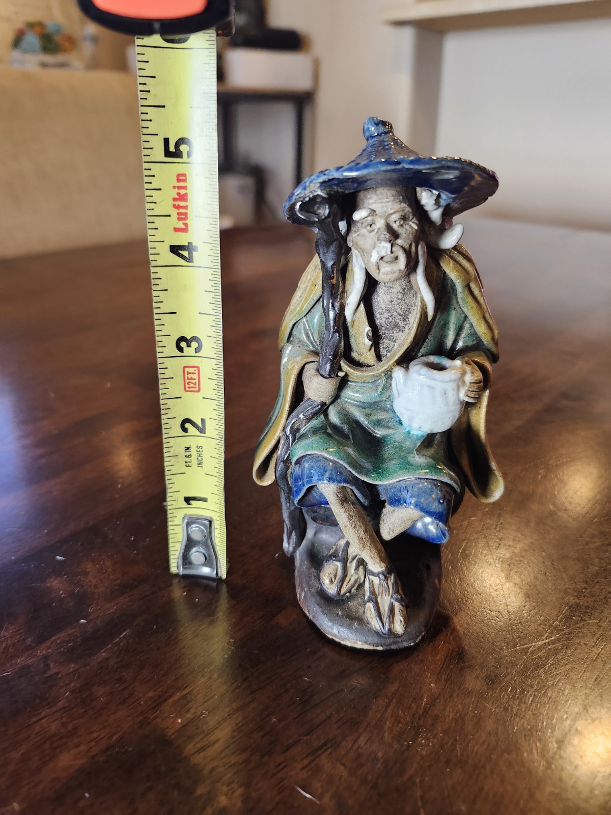 Glazed Ceramic Asian Mud Man Figurine Seated w/ Hat Holding Cup 5.75 in Tall