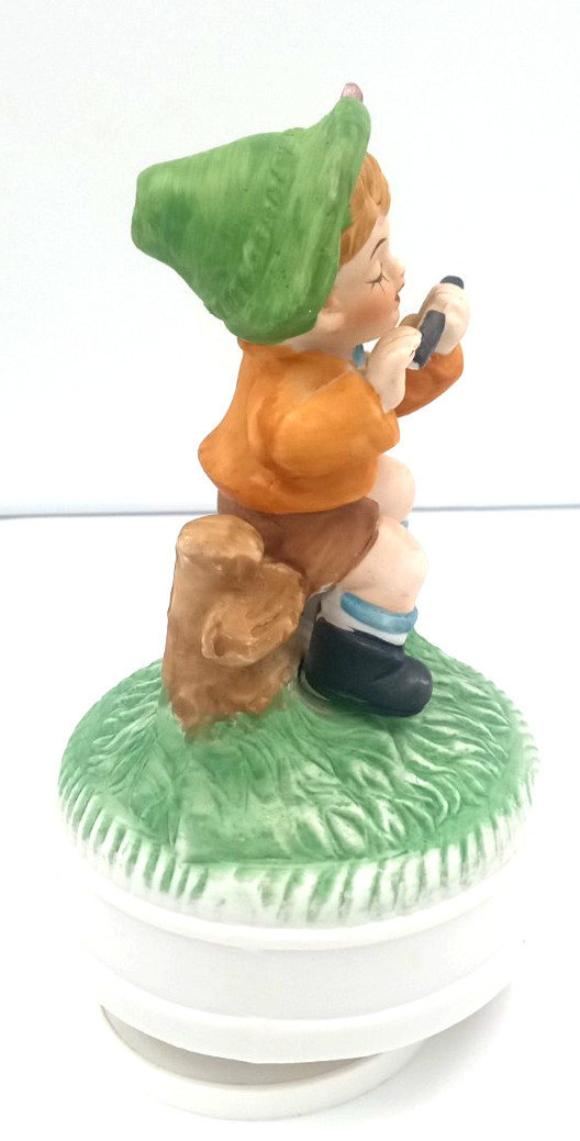 Vintage Boy Sitting On Fence Playing Flute 7″ Porcelain Figurine Music Box