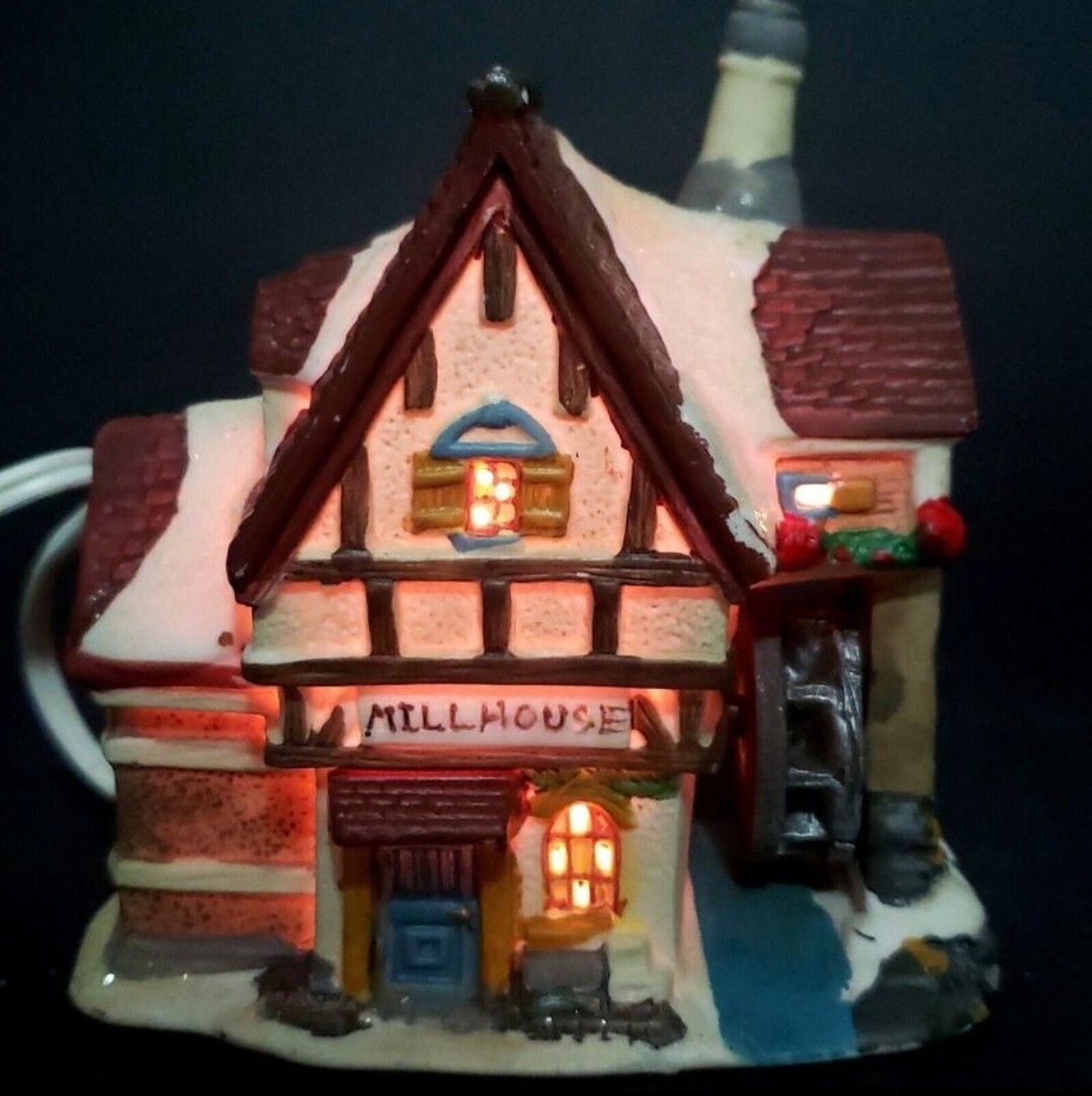 Charming Handcrafted Millhouse Figurine with Snow-Capped Roof and Flowing Water.