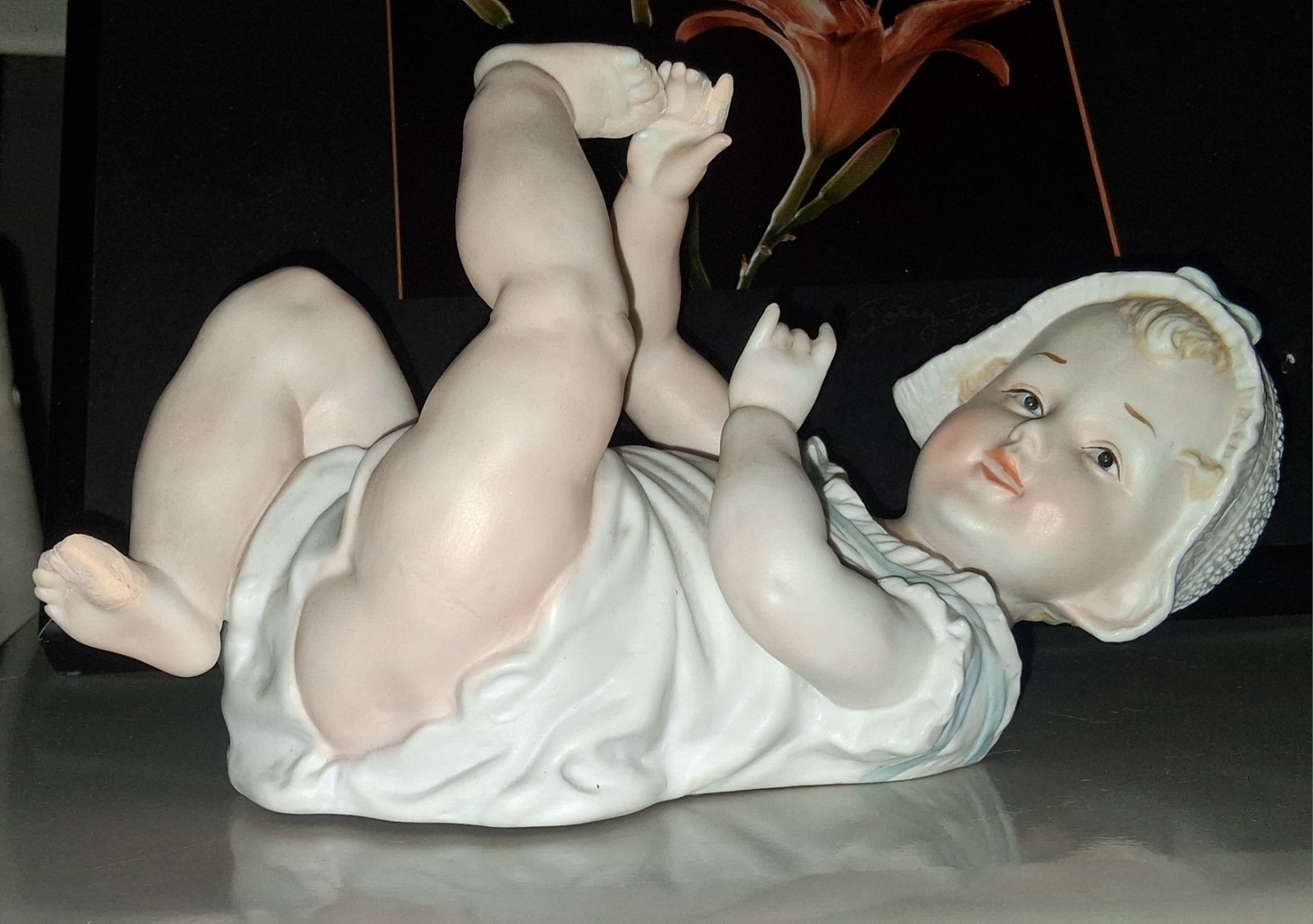 Gebruder Heubach-German Porcelain Bisque-Lying On Back Piano Baby–11″ Length