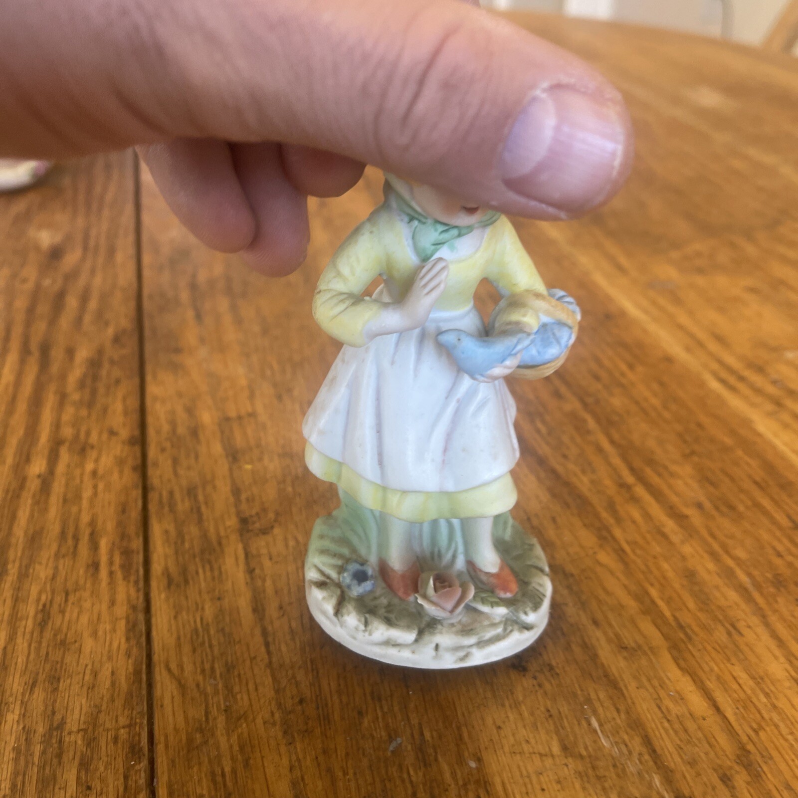 Porcelain Figurine Woman Holding Basket With Bird In Hand Flowers On Base