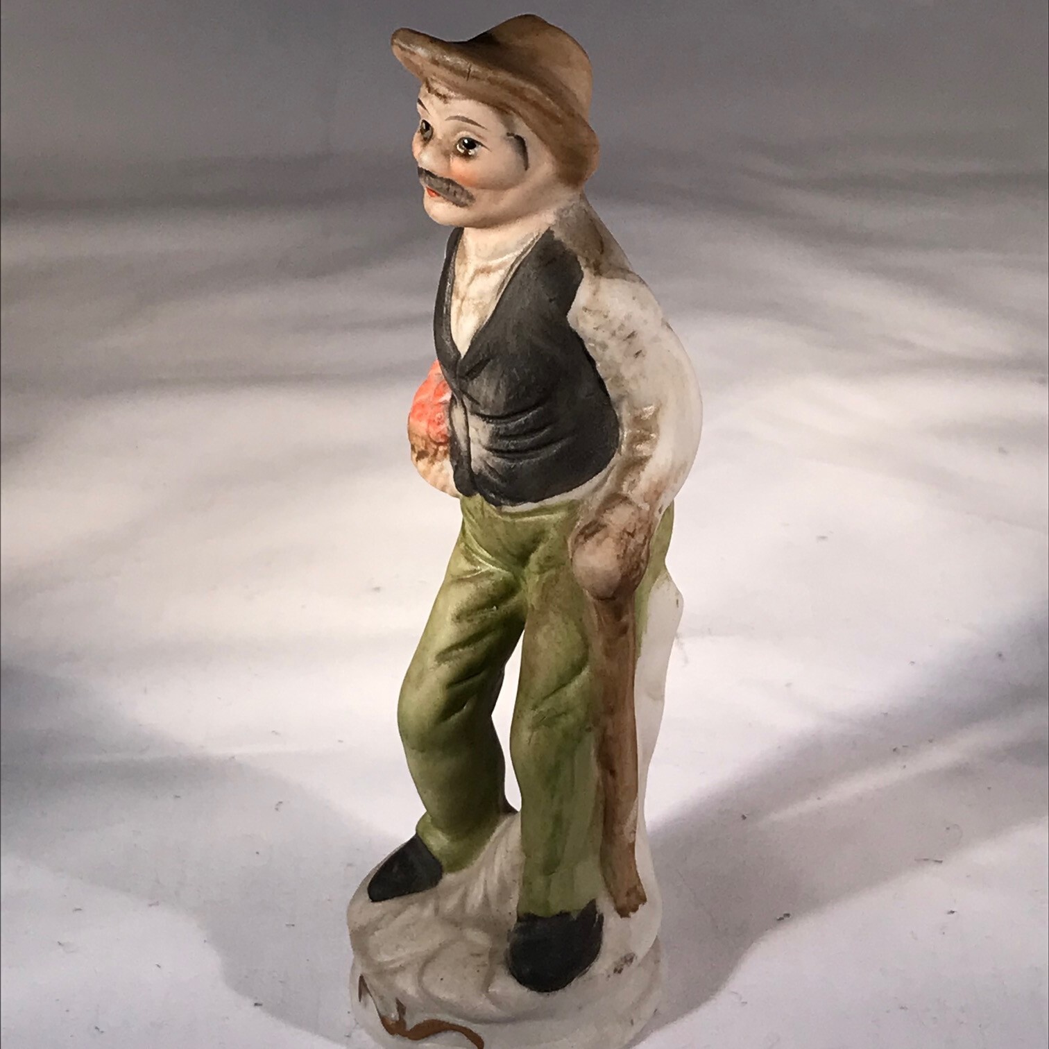 Flambro Fine Porcelain Figurine Man Vest Hat Basket Produce 5 3/4 Inches Tall