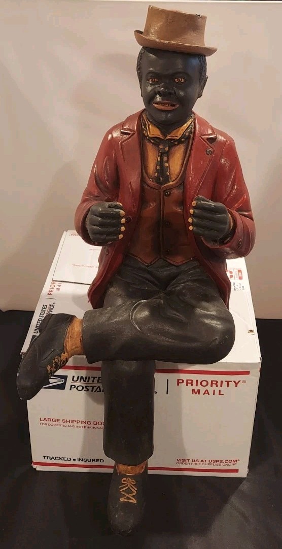 Sitting Gentleman In Red Coat With Hat