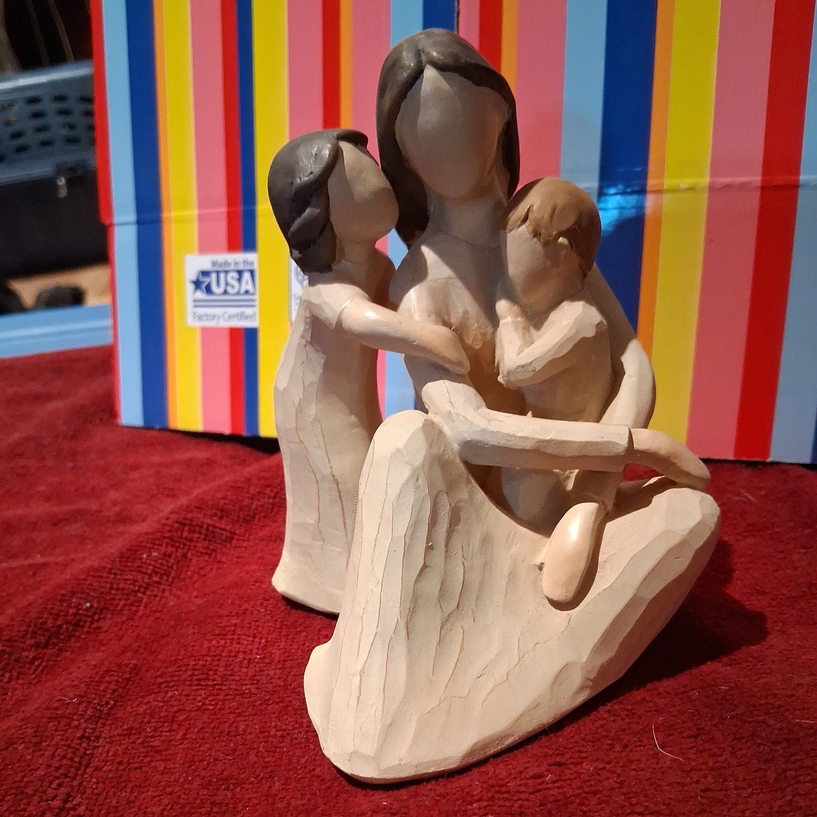 Mother Figurine holding children quietly .medium size..unmarked
